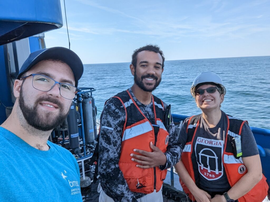 Lowin with two undergraduate students on the R/V Savannah. 