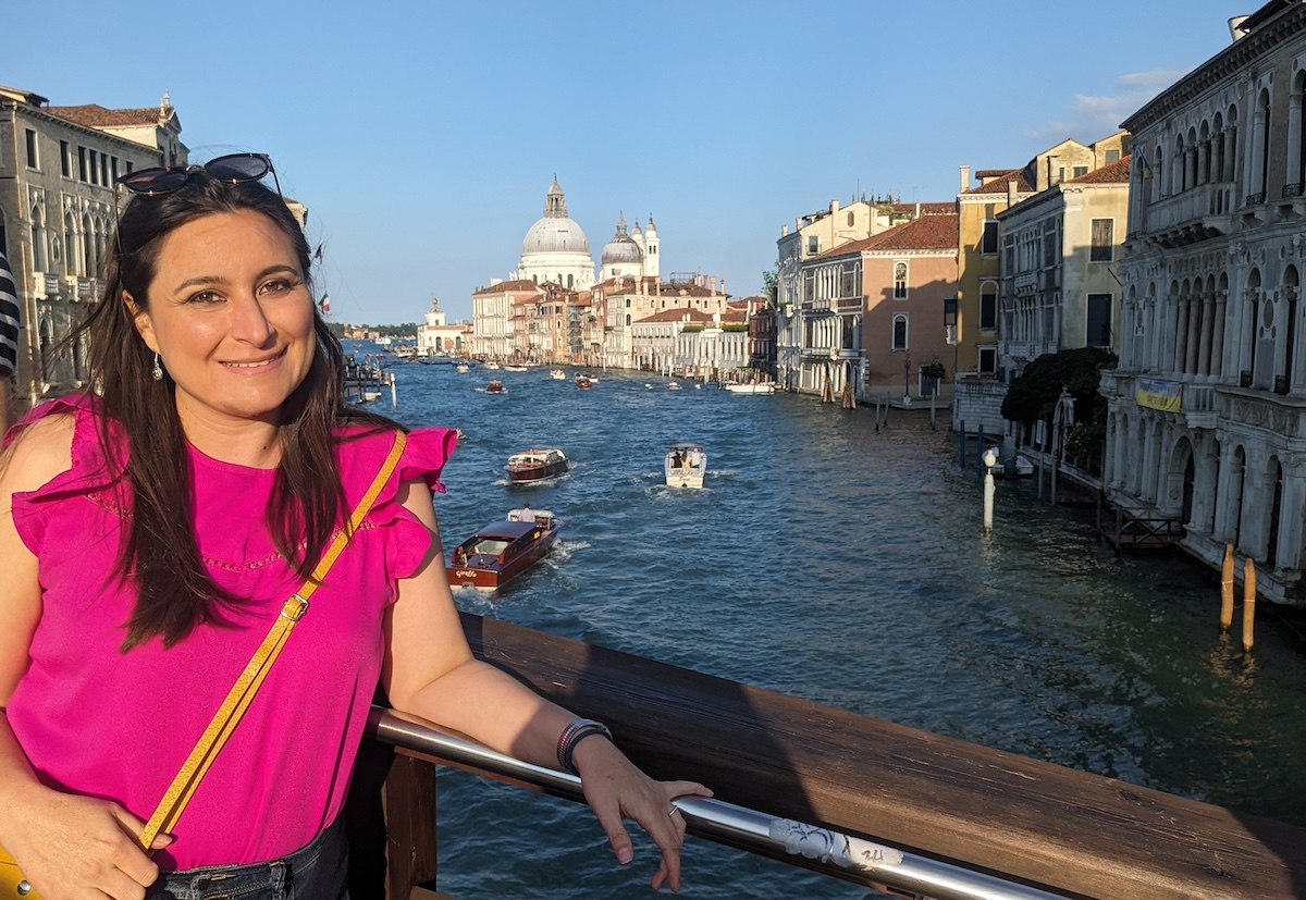 Skidaway researcher Sara Rivero-Calle stands on a bridge above one of Venice's canals.