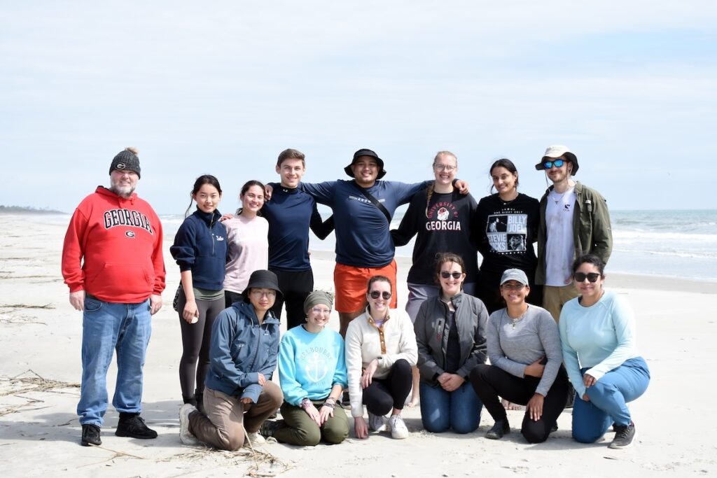 The graduate students and faculty member Jay Brandes gather for a photo on Wassaw Island. 